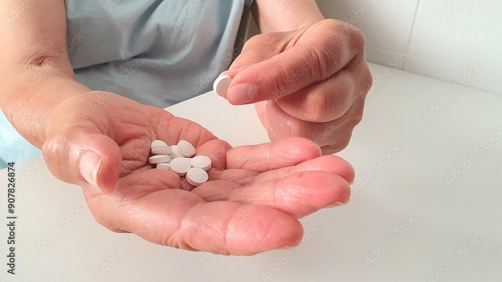 Pills in hands. Taking medications and vitamins. Dosage of medications. Treatment of illnesses, the sick, support of health in old age.
Pills in hands. Taking medications and vitamins. Dosage of medications. Treatment of illnesses, the sick, support of health in old age.