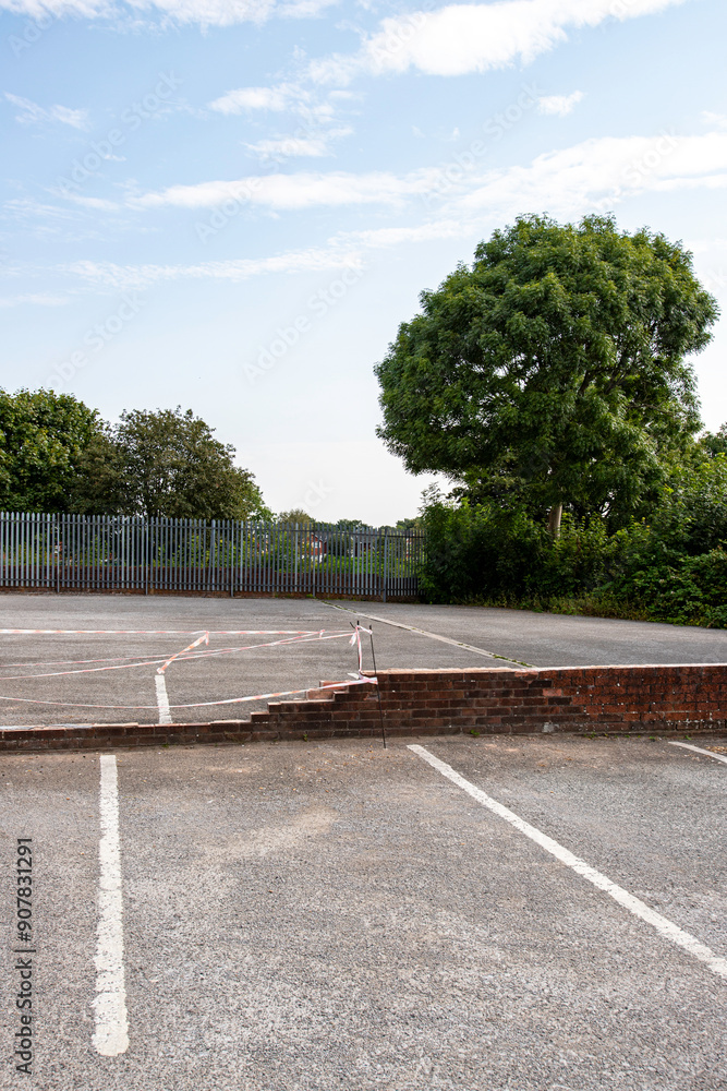 Aftermath of car driving into wall on parking places Aftermath of car driving into wall on parking places