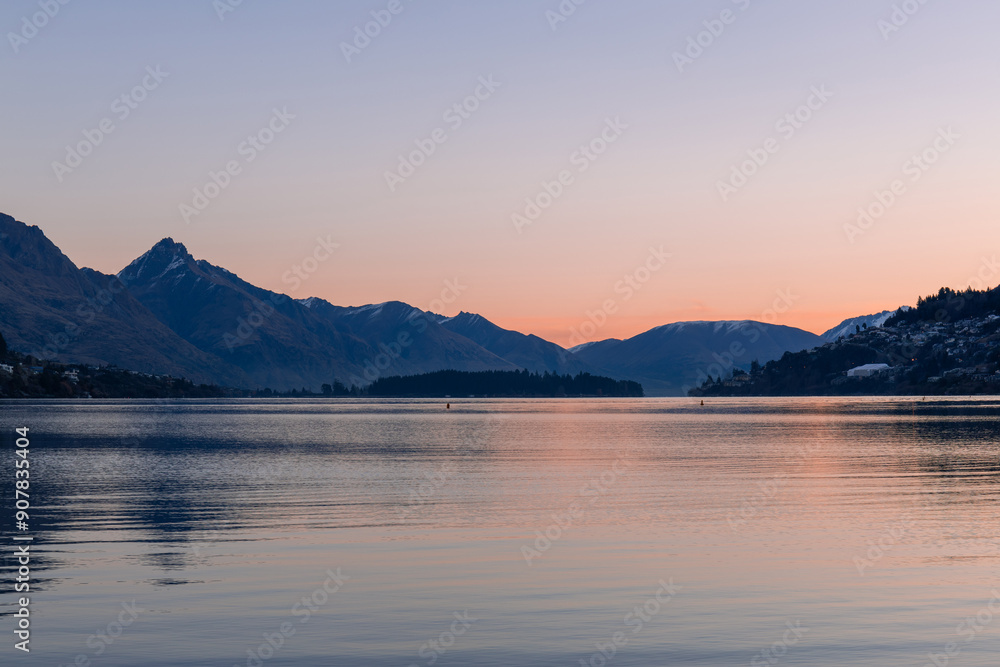 Sunset view of lake and mountains in Queenstown, New Zealand. Sunset view of lake and mountains in Queenstown, New Zealand.