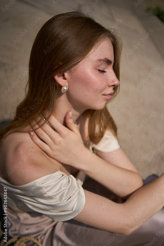 beautiful teenage girl in a silk skirt and corset in the old money style. Fashion photoshoot under the bridge. beautiful teenage girl in a silk skirt and corset in the old money style. Fashion photoshoot under the bridge.
