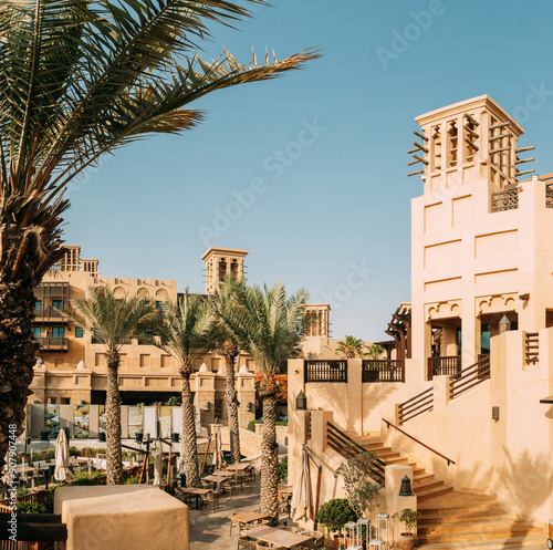 View of Madinat Jumeirah Arabian Resort. It is the largest resort in the Emirate. View of windcatcher in sunny summer day in district of Madinat Jumeirah. Panorama, panoramic view photo