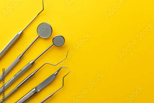 Promoting dental hygiene and oral health. Top view of dental tools on a yellow background with space for text photo