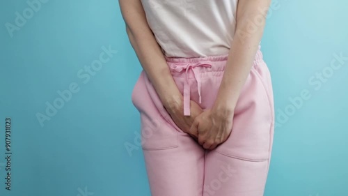 Urinary incontinence, woman holding crotch, urgent need to urinate, health issue, cystitis.