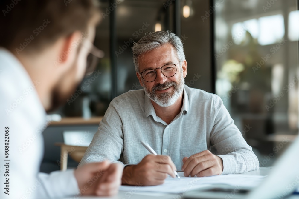 Strategic Financial Adviser Assisting Client in Goal Setting Session Strategic Financial Adviser Assisting Client in Goal Setting Session
