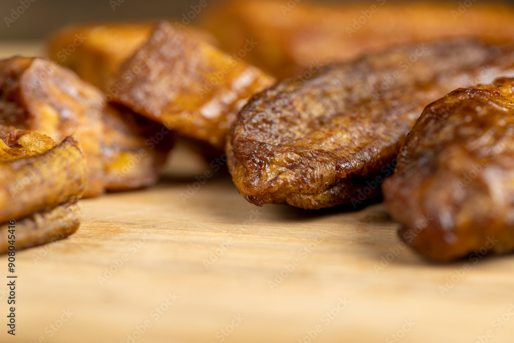 dried small bananas on a wooden board dried small bananas on a wooden board