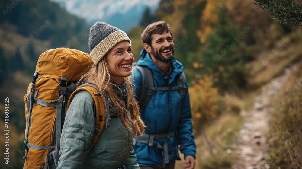 Couple smiling and holding hands on a mountain trail Couple smiling and holding hands on a mountain trail