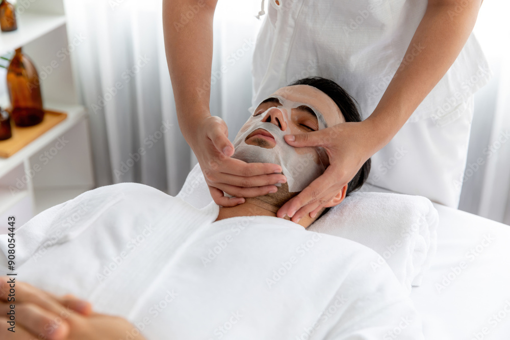 Serene modern daylight ambiance of spa salon, woman customer indulges in rejuvenating with facial skincare mask. Facial skin treatment and beauty cosmetology procedure for face. Quiescent Serene modern daylight ambiance of spa salon, woman customer indulges in rejuvenating with facial skincare mask. Facial skin treatment and beauty cosmetology procedure for face. Quiescent
