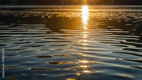A picturesque sunset on a lake, with stunning reflections of orange and pink hues shimmering on the water