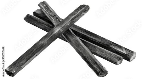 A group of four black sticks arranged in an X shape, creating a simple but striking visual.