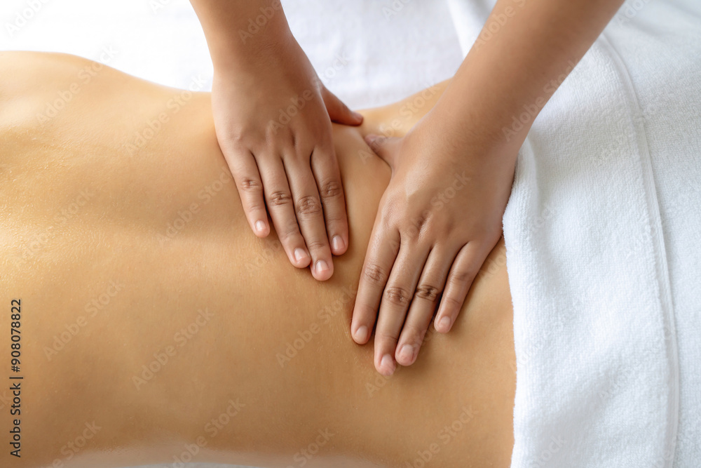 Closeup woman customer enjoying relaxing anti-stress spa massage and pampering with beauty skin recreation leisure in day light ambient salon spa at luxury resort or hotel. Quiescent Closeup woman customer enjoying relaxing anti-stress spa massage and pampering with beauty skin recreation leisure in day light ambient salon spa at luxury resort or hotel. Quiescent
