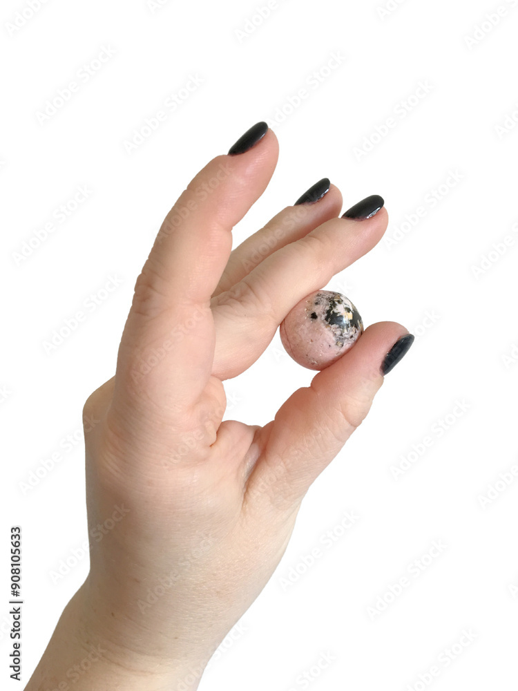 Female Hand Holding Pink and Black Rhodochrosite Crystal Female Hand Holding Pink and Black Rhodochrosite Crystal