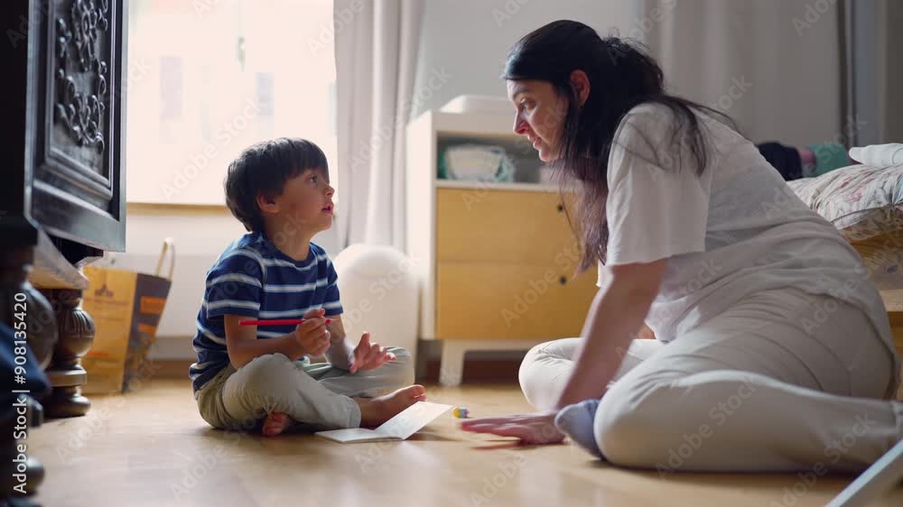 Mother and son sitting on the floor, chatting and working on a drawing project together, creating a moment of connection and creativity in a bright and cozy home environment Mother and son sitting on the floor, chatting and working on a drawing project together, creating a moment of connection and creativity in a bright and cozy home environment