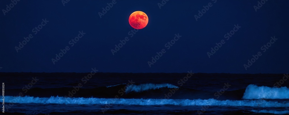 Majestic red moon over calm ocean waves at night in coastal landscape Majestic red moon over calm ocean waves at night in coastal landscape