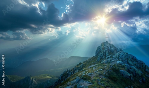Crucifix at the top of a Mountain with Sunlight Breaking through the Clouds. Inspirational Christian Image.