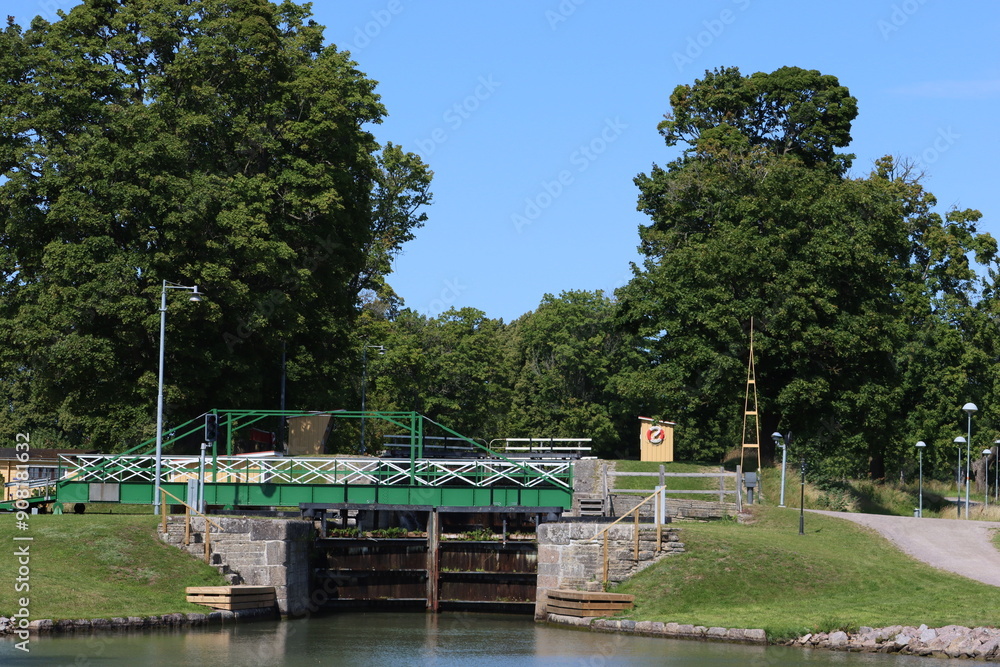 Fototapeta premium Geta channel. Carl Johan, King Charles XIV John and his son, Prince Oscar, visited the flight of locks during their construction. He laid two foundation stones, which is why the locks carry his name.
