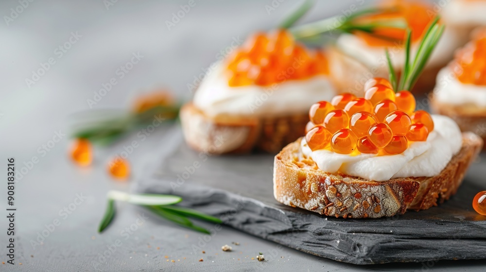 Close-up shot of bread topped with cream cheese and orange jam, adorned with green foliage Close-up shot of bread topped with cream cheese and orange jam, adorned with green foliage
