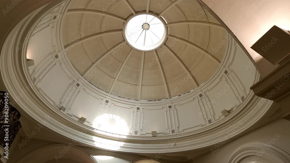 Beautiful semicircular dome from the inside with blue cloudy sky outside. Beautiful semicircular dome from the inside with blue cloudy sky outside.