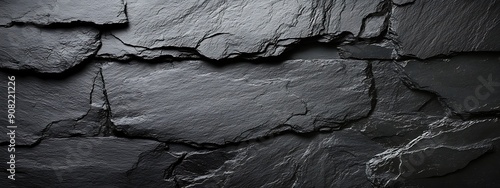 Panel kuchenny z motywem  Dark grey black slate texture background. Black stone texture. Black granite slabs background 