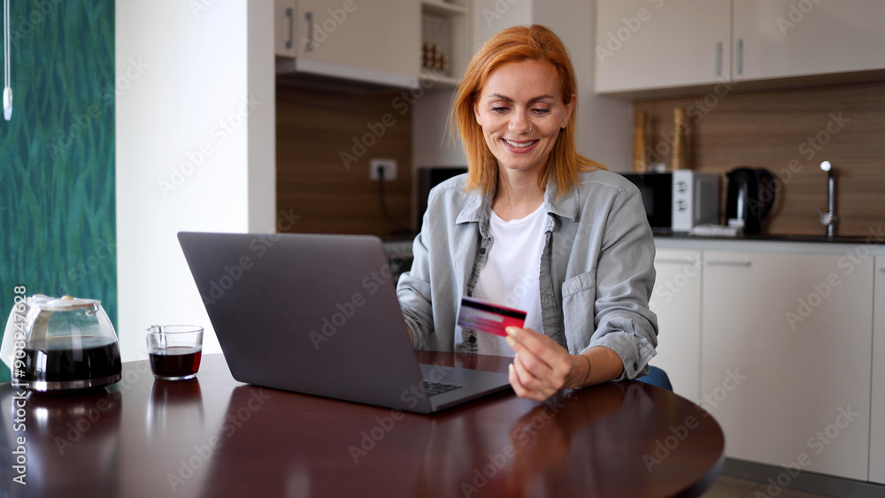 Happy woman using laptop and shopping online at home Happy woman using laptop and shopping online at home
