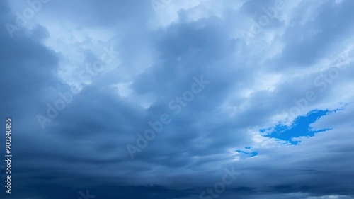 The peaceful blue sky transformed into a churning sea of dark clouds as the cold front brings an icy blast of winter weather. photo