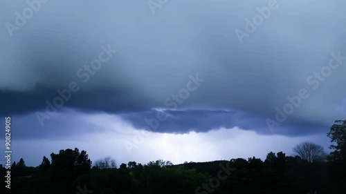 The air becomes heavy and oppressive as the sky grows darker signaling a powerful storm approaching. photo