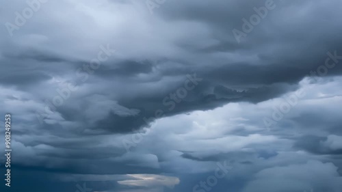 The sudden shift in winds causes the rolling clouds to billow and swirl forewarning of a fierce storm approaching.
