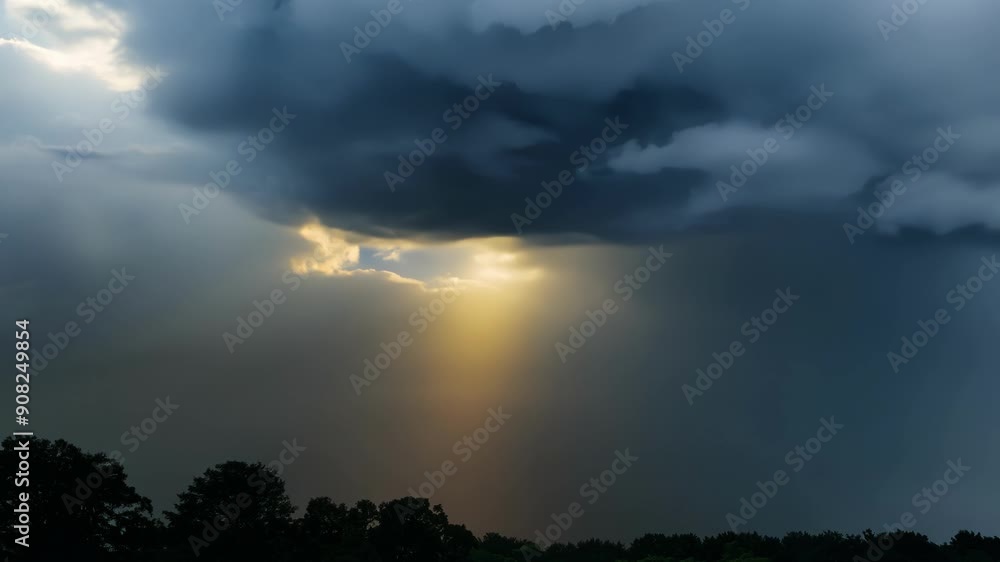 A closeup of dark storm clouds shifting and changing eventually breaking apart to reveal rays of sunlight breaking through and illuminating the sky. A closeup of dark storm clouds shifting and changing eventually breaking apart to reveal rays of sunlight breaking through and illuminating the sky.