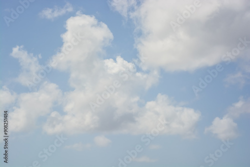 Fluffy white clouds on blue sky background during day . 