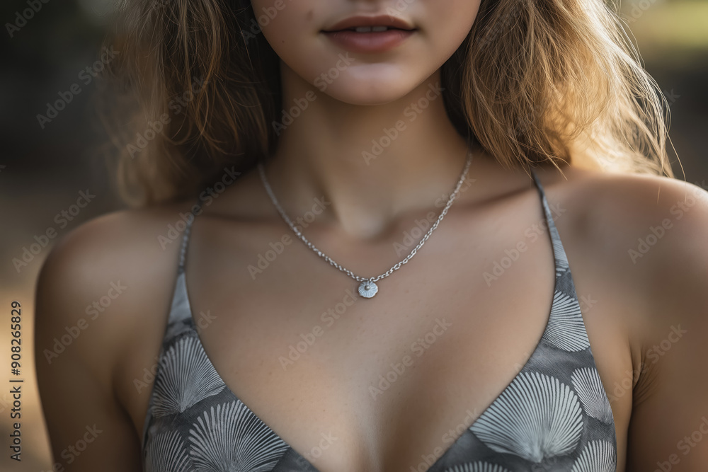 sensual closeup portrait of a young woman with a delicate silver necklace and top swisuit sea shell print sensual closeup portrait of a young woman with a delicate silver necklace and top swisuit sea shell print