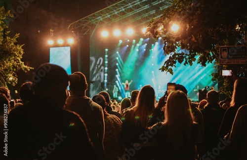 concert with a crowd of people who came to watch the event in the evening in Estonia photo