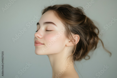 A close up of a girl's face with her eyes closed