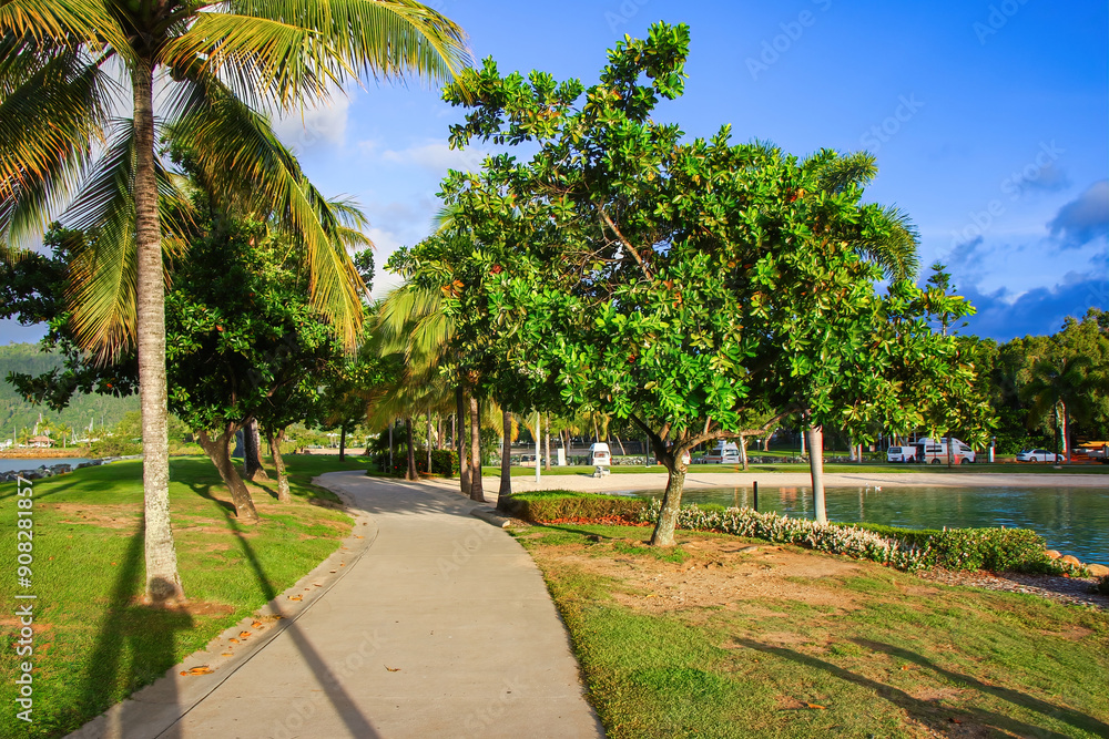 Pathway on the waterfront of Airlie Beach on the coast of Queensland facing the Whitsunday Islands in the Pacific Ocean, Australia Pathway on the waterfront of Airlie Beach on the coast of Queensland facing the Whitsunday Islands in the Pacific Ocean, Australia