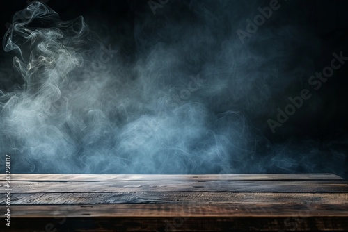 Dark empty wooden table with smoke on a dark wall background