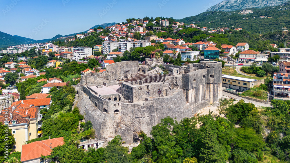 Fototapeta premium Aerial view of the turkish fortress of Kanli Kula in Herceg Novi, a town in located at the western entrance to the Bay of Kotor on the coast of the Adriatic Sea in Montenegro
