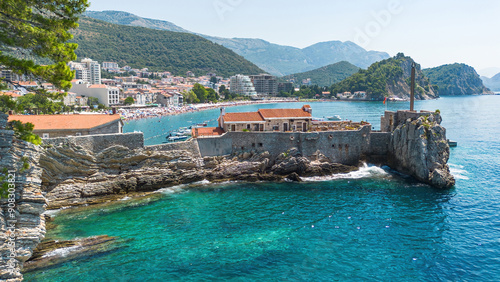 Aerial view of the Kastio Castle built on a peninsula in Petrovac na Moru, a resort town located on the coast of the Adriatic Sea in Montenegro photo