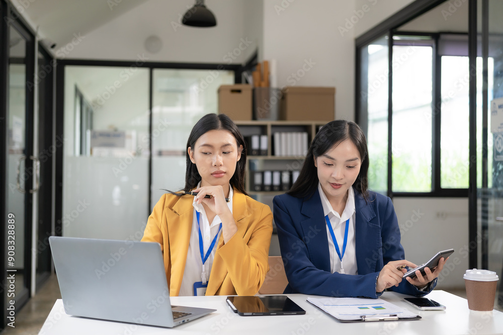 Two Asian women are checking their income by working in online sales. with laptops because sales are in line with desired targets
success Two Asian women are checking their income by working in online sales. with laptops because sales are in line with desired targets
success