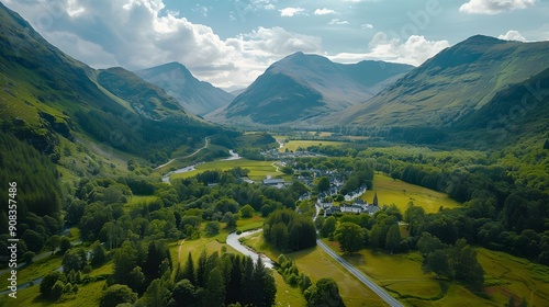 An aerial shot focused on the heart of the Glencoe valley, showcasing the iconic Three Sisters mountains with their distinct photo