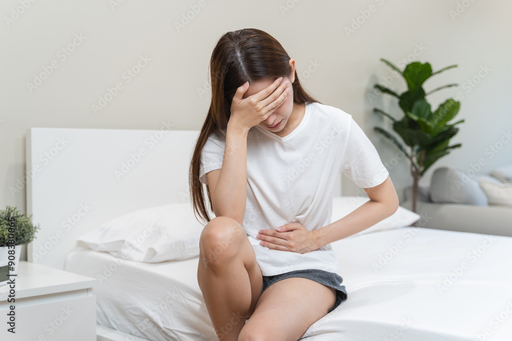 Monthly menstruation symptom period concept. Close up calendar marking on menstruation period day and woman have stomach pain as background. Monthly menstruation symptom period concept. Close up calendar marking on menstruation period day and woman have stomach pain as background.