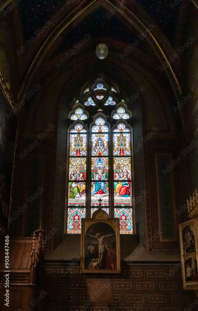 Fototapeta premium One of stained glass windows of the Saints Peter and Paul Basilica in the Vysehrad district of the Prague in the Czech Republic