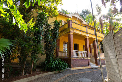 Fachada da Mansão na Chácara Lane - SÃO PAULO, SP, BRAZIL - JUNE 15, 2024: Historic house on Chácara Lane seen from the entrance gate, currently one of the city's museums maintained by the city hall.