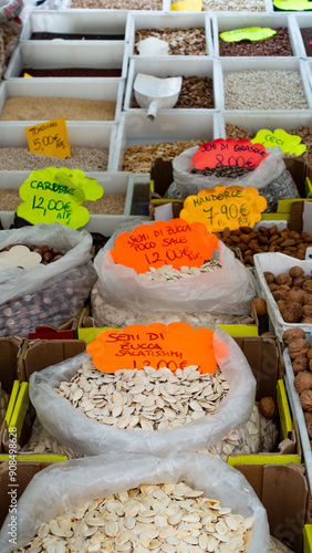 Street market stalls with dried legumes, Rome, Italy