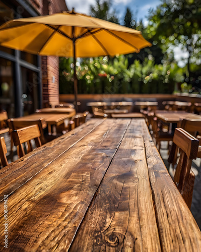 photo wooden table and blurred background of outdoor restaurant with bokeh light. High quality photo 