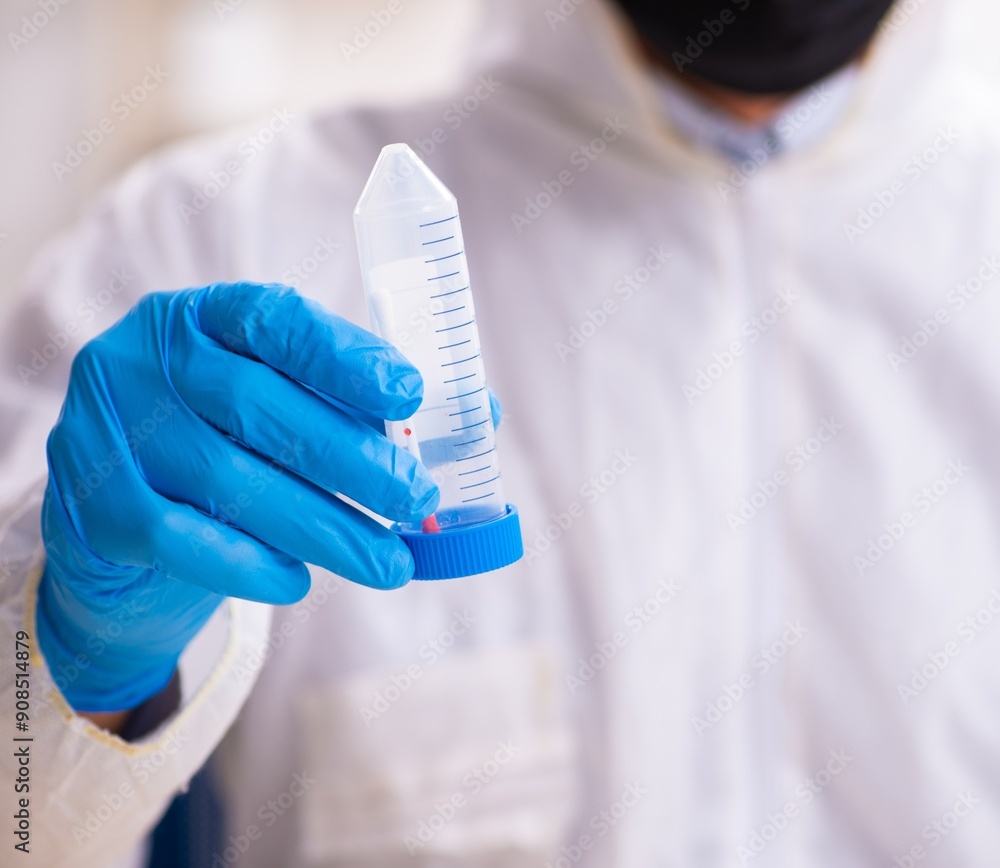 Male expert criminologist working in the lab for evidence Male expert criminologist working in the lab for evidence