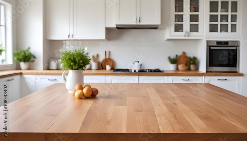 A wooden table top in the foreground with a blurred kitchen interior in the background, including white cabinets, a window, and some decorative item