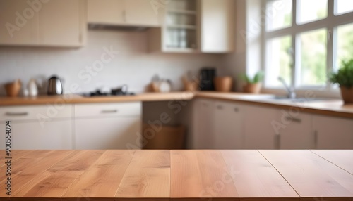 Wooden table top with blurred kitchen interior in the background