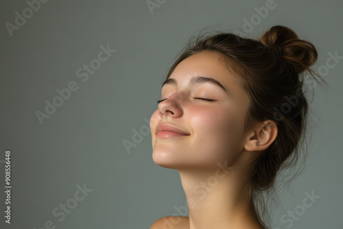 A close up of a girl's face with her eyes closed