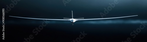 Silhouette of a small airplane flying over water. photo