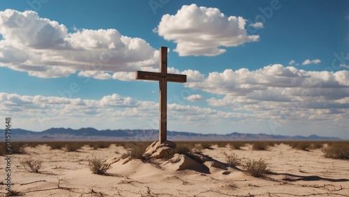 Cross in the desert with blue sky and clouds. photo