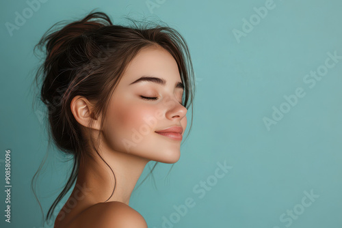 A close up of a girl's face with her eyes closed