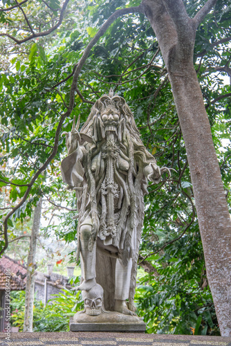 the king's water temple or water palace. Tropical landscape, colorful flowers and statues can be found on the Tirta Gangga site, Bali, Indonesia photo